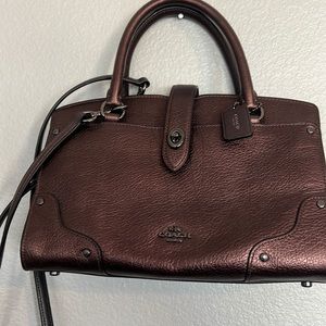 Mini coach purse copper brown .